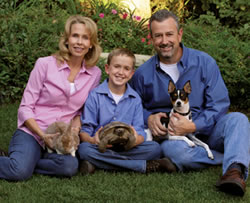 Ann, Phillip and Eric Huff with Russell the dog, Jeffrey the rabbit and Travis the tortoise