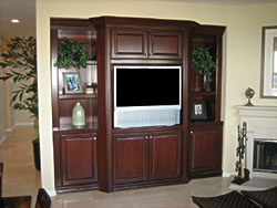 What new SCV home is complete without an alcove situated in the family room? Attractively display (or hide) your entertainment system in a customized wood alcove from Woody