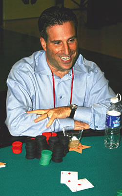 Is he bluffing? Mark Emert cracks a big smile at the first-annual Texas Hold