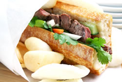 The Beef Baguette Sandwich is great for lunch or dinner! The mouthwatering, tender strips of beef are marinated in a special Vietnamese lemongrass sauce and grilled to perfection. Served on a warm, crusty baguette, along with cucumber, pickled daikon