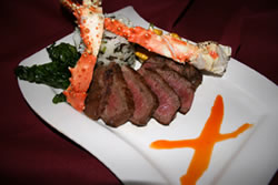 The succulent King Crab Legs and pan-seared Filet Mignon, garnished with fried basil and a roasted red pepper oil, could only be Robinson Ranch Sycamore Bar & Grill