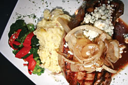 The New York Cherry Port Steak is slow roasted and smothered in caramelized onions and gorgonzola cheese. Served with seasonal veggies and parmesan garlic mashed potatoes. Cigar Night Thursdays, Classic Rock Fridays and Jazz on Saturdays. <strong>Roa
