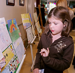 Artist Hannah Wilken, 9, admires others