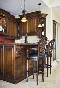 The custom bar area was moved several feet to the right to create more cabinet space. "I was able to pull my wedding and Christmas china out of the garage once we finished it," says Talbot.