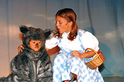 The roll of Dorothy is capably played by Arlene Henry. Here, she shows off her strong singing voice. Also pictured is Christopher Perry, who plays Toto