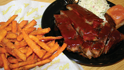 Try the authentic, fall-off-the-bone tender, 100-percent delicious <b>BBQ Pork Rib Plate</b>, done St. Louis style! Choose two sides: Sweet Potato Kettle Fries, Classic Big Island Fries, Sugarcane BBQ beans, Island Coleslaw or freshly-made Kona chips