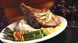 "A must order...perfection on the bone," claims Elmer Dills of K-ABC Eyewitness News of <b>The Grille Chop</b>. The cured center cut, double-thick pork chop with apple cider brine is served with horseradish mashed potatoes, fresh asparagus, a baked a