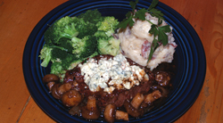 The <b>Flat Iron Steak</b> is served on a bed of caramelized onions and topped with melted gorgonzola cheese and mushrooms. Roasted garlic mashed potatoes and fresh broccoli add to the exquisite mix. Dine in, take out, banquet room and catering avail