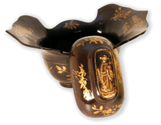 Ornamental box shaped like an ancient gold ingot and decorated with auspicious flowers and butterflies in gold lacquer