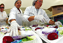 Food Services staff prepare meals for summer school students. Production begins at 6:30 a.m. and is delivered to individual school sites in time for lunch.