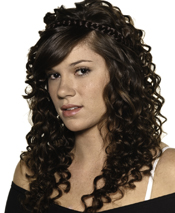 Got body? This spiral set creates a springy curl. A flat-ironed side-swept bang and braided crown adds serious style. A nearly-nude face keeps you from looking overdone.