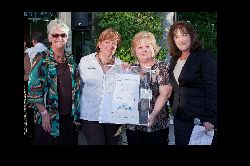 Pictured are Marti Heinbaugh (VP/regional manager of Mission Valley Bank), Carol Rock, Belinda Crawford (executive director of the SCV Food Pantry) and Tamara Gurney (president and CEO of Mission Valley Bank). Photo by Mitch Wu