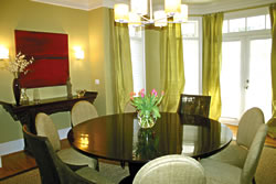 Dupioni silk in the same shade as the paint was used to create these simple, yet elegant, window treatments in this clean and contemporary dining room.