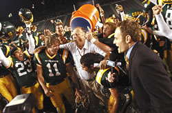 Coach Harry Welch of Canyon High is congratulated for his fourth section title. The Cowboys finished the season as the top ranked team in California. Photo by Eddie Sadiwa courtesy of The Signal.