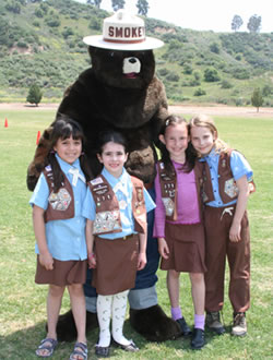 Smokey the Bear celebrates his 60th birthday at Arbor Day with friends from Troop 371,