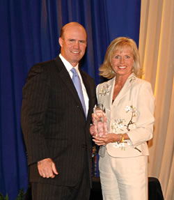 Cheri Fleming, here with Newsweek Publisher Pat Haggerty, was recently awarded the title of Dealer of the Year by AIADA
