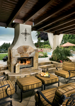 Many an evening is spent relaxing atop the outdoor furniture purchased from Oasis Garden & Patio. An iron cross, purchased from the San Fernando mission, represents the location in which the couple was married. A vase, selected from The Decor Store, 